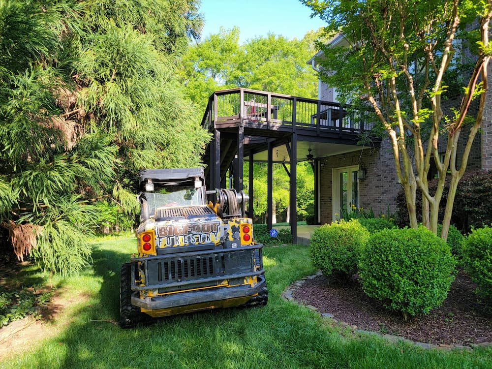 a tractor in a backyard on the grass