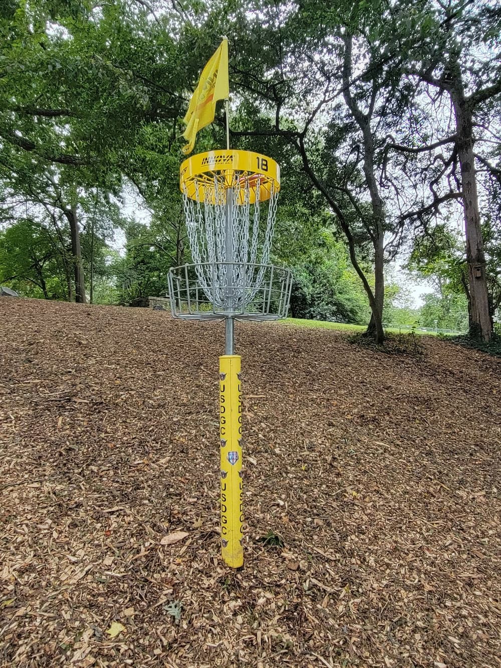 yellow structure with chains in the ground